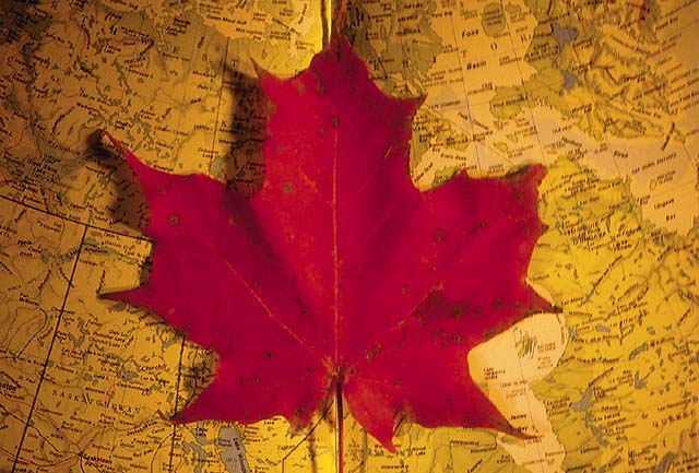 A Maple Leaf Over A Map Of Canada